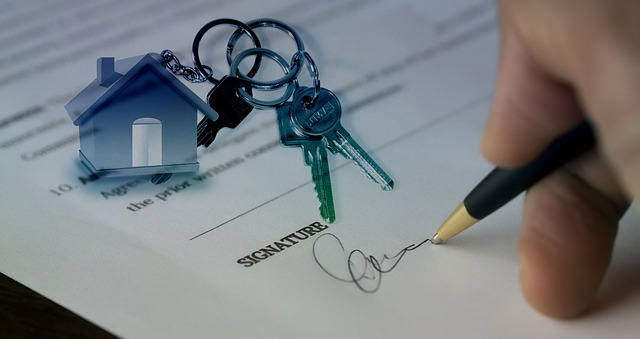 Homeowner signing a purchase offer